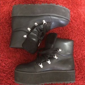 Platform lace up boots.